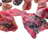 Side-on view of Rhodonite raw stone, sourced from Masvingo, Zimbabwe.