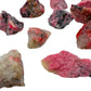 Back view of Grade AA Rhodonite raw stone, associated with Emotional Healing, sourced from Masvingo, Zimbabwe.