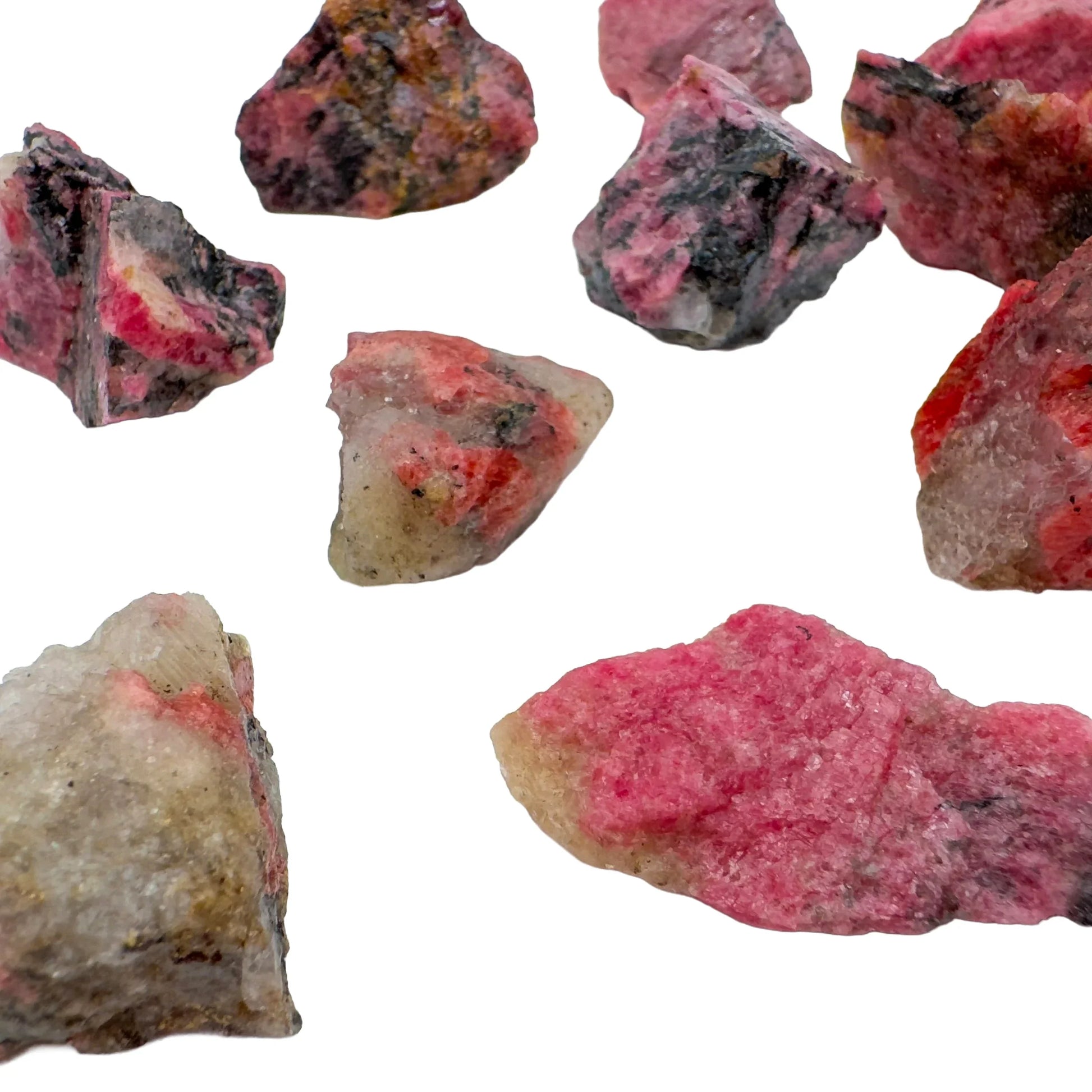 Back view of Grade AA Rhodonite raw stone, associated with Emotional Healing, sourced from Masvingo, Zimbabwe.