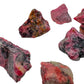 Scale reference of a single Rhodonite raw stone Zimbabwe-sourced.