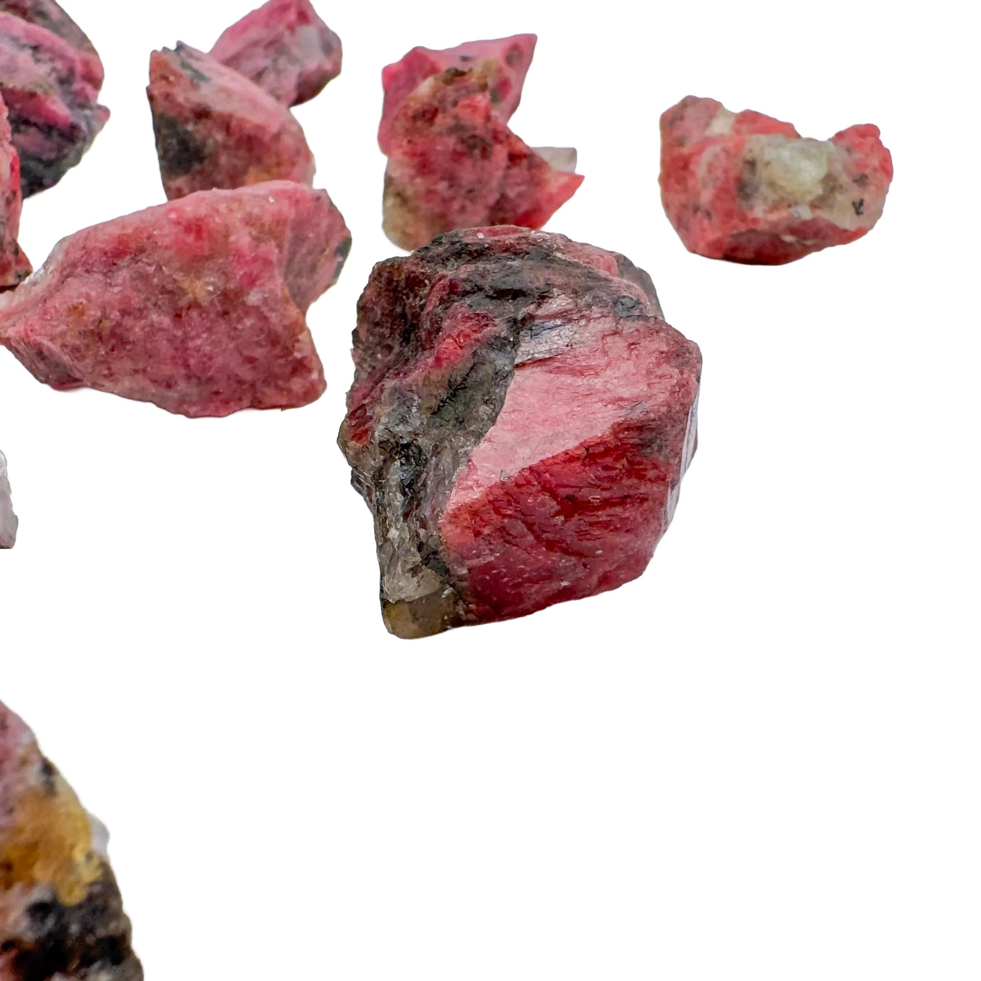 Back view of Grade AA Rhodonite raw showing natural surface