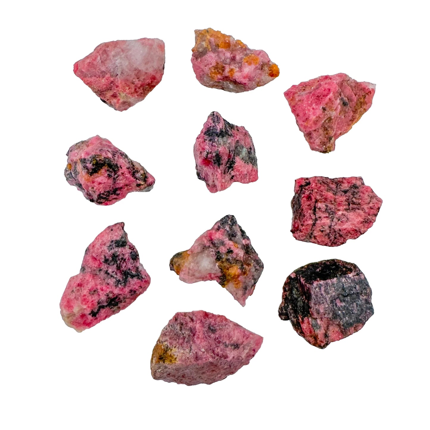 Surface detail of Rhodonite raw stone, often kept for Emotional Healing and Love, showing characteristic color.