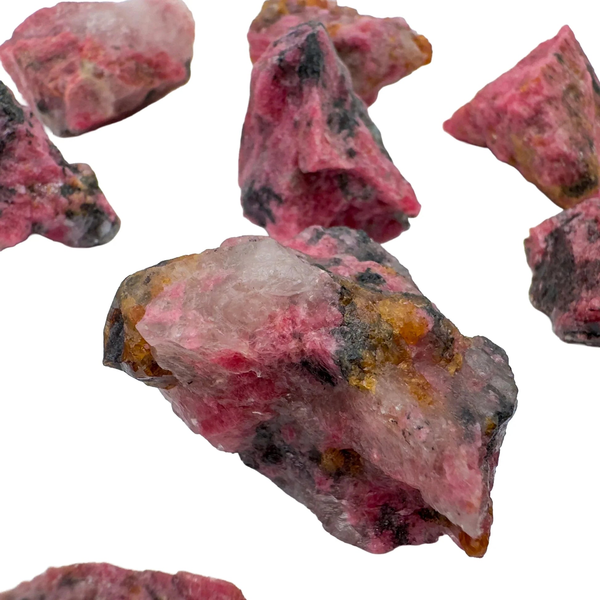 Reverse side of Grade AA pink Rhodonite raw stone, showing natural banding, sourced from Zimbabwe.