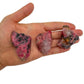 Back view of Grade AA Rhodonite raw showing natural surface