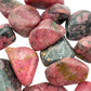 Underside view of Rhodonite tumbled stone, sourced from Masvingo, Zimbabwe, worked with for Emotional Healing and Love.