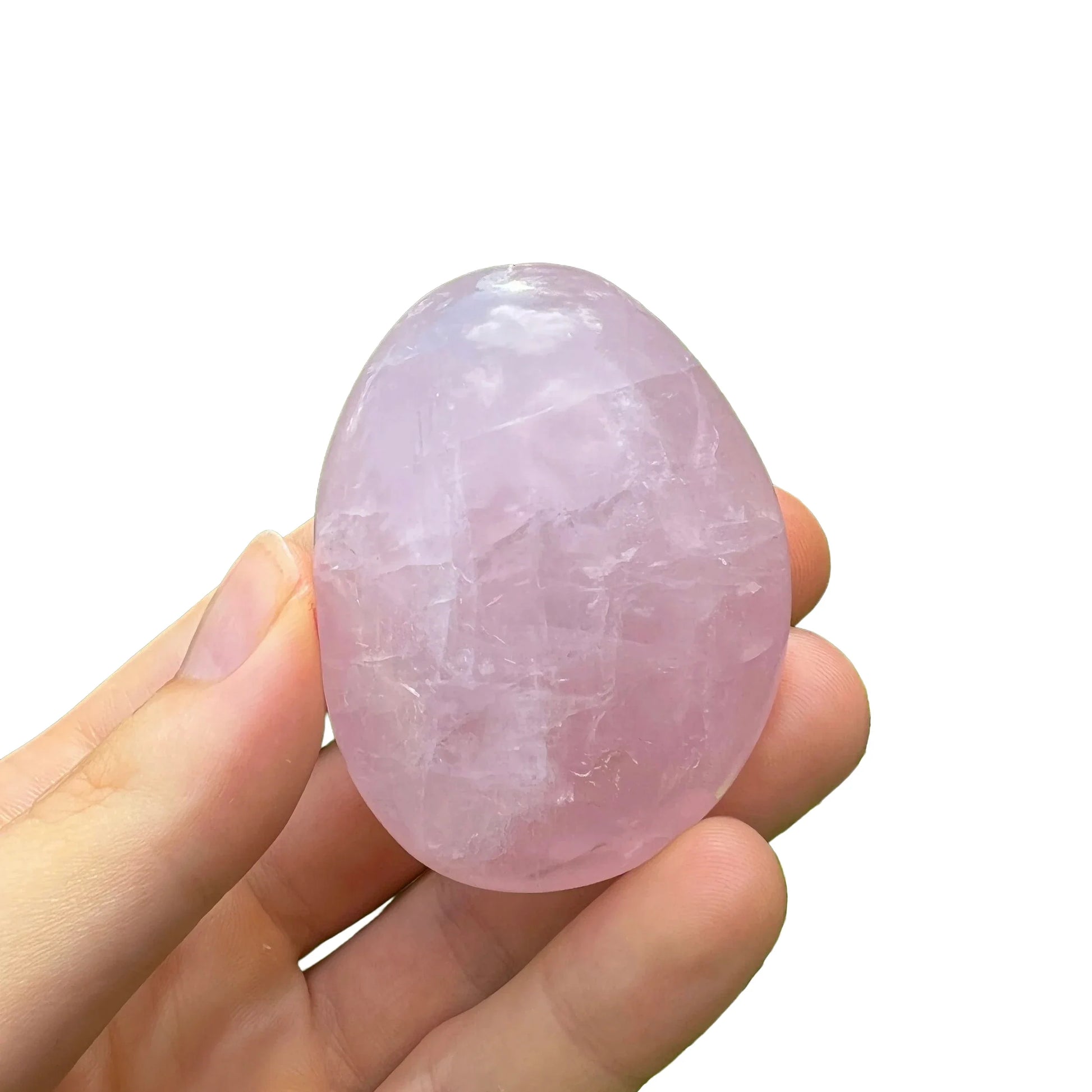 Profile view of pink Rose Quartz palm stone, showing earthy tone, turned to for Love.