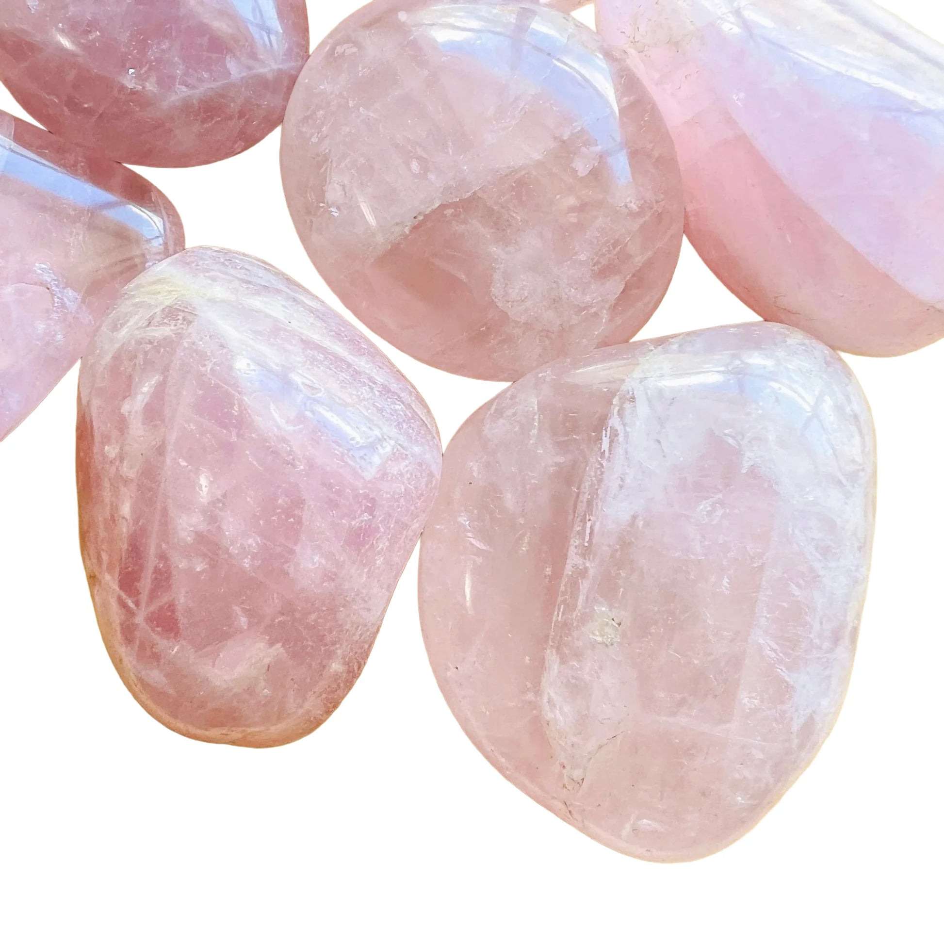 Underside view of pink Rose Quartz palm stone, kept close for Love, sourced from Madagascar.