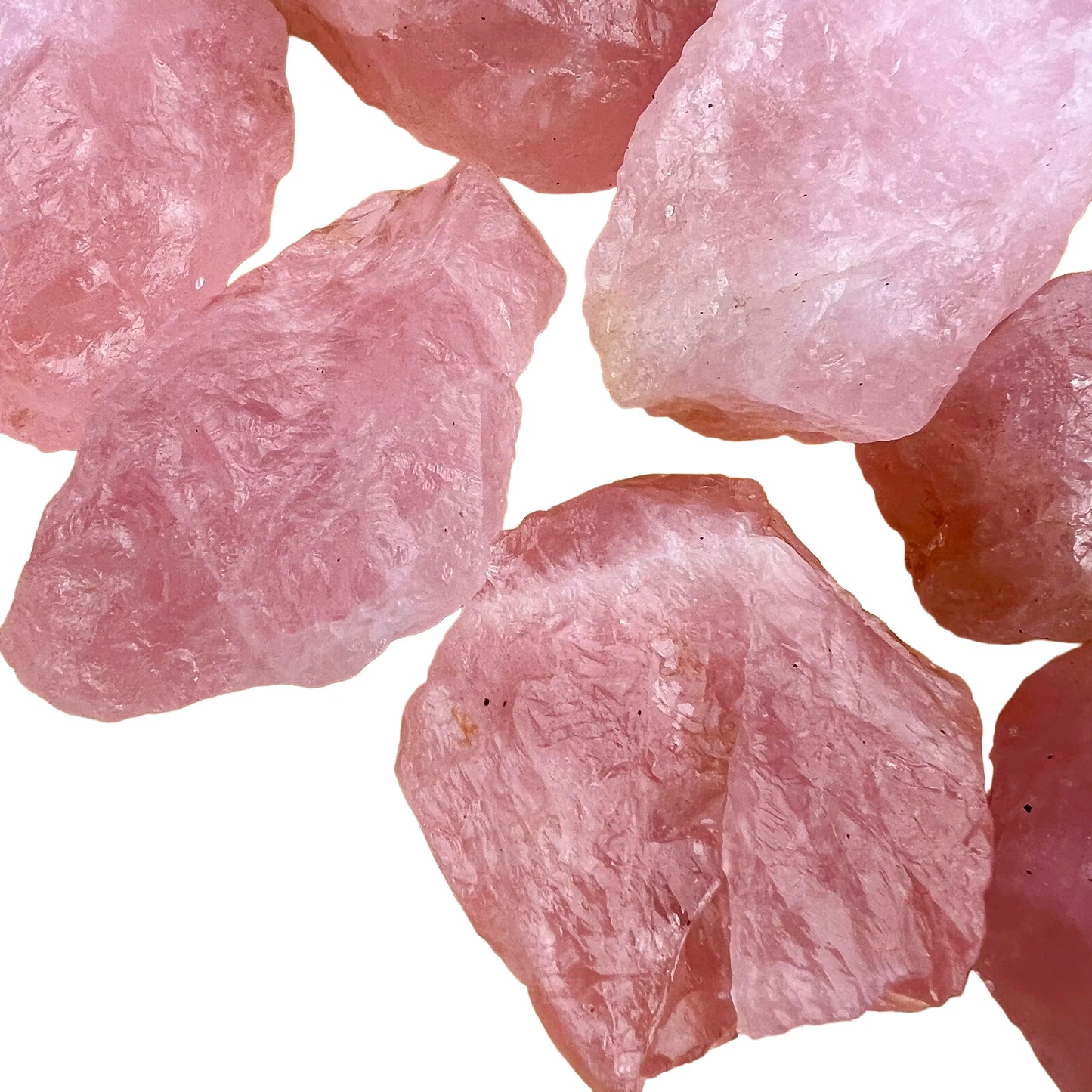 Tight crop of Grade AA Rose Quartz raw stone, sourced from Brazil, often paired with practices around Love.
