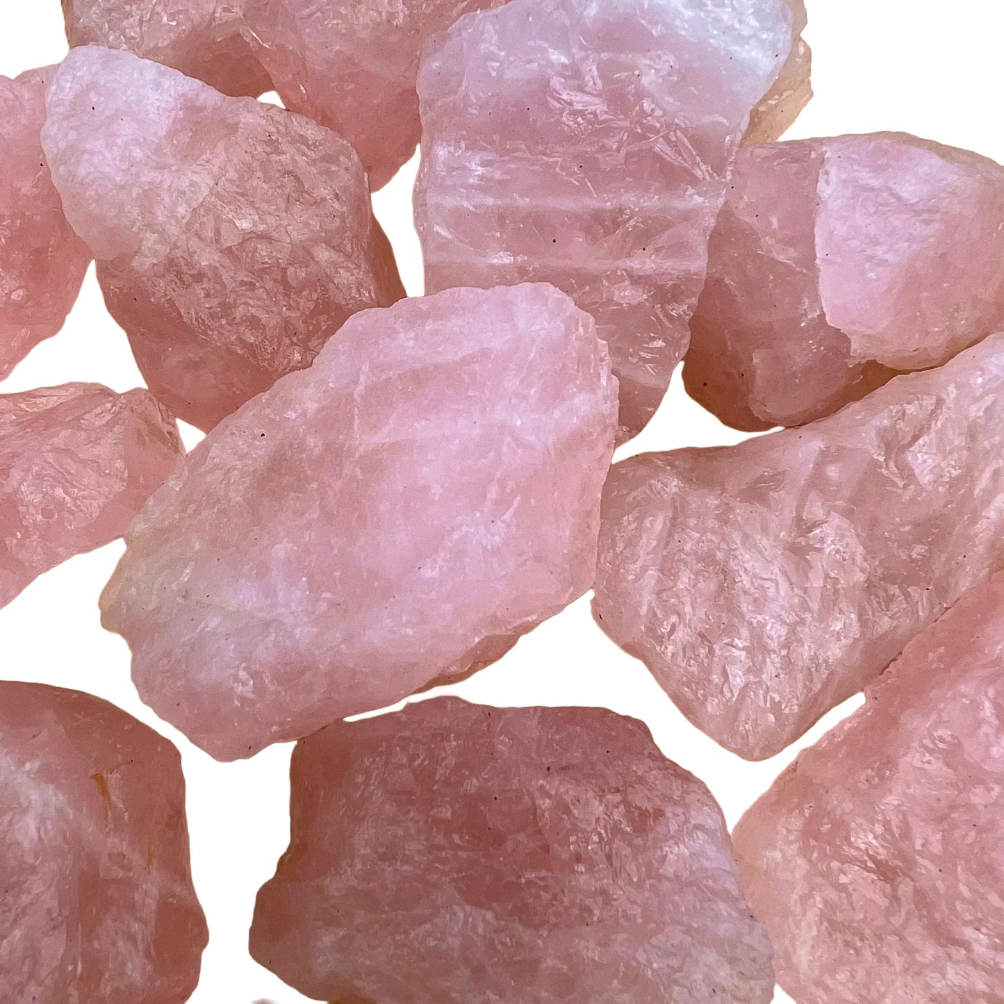 Side perspective of pink Rose Quartz raw stone, showing subtle veining.
