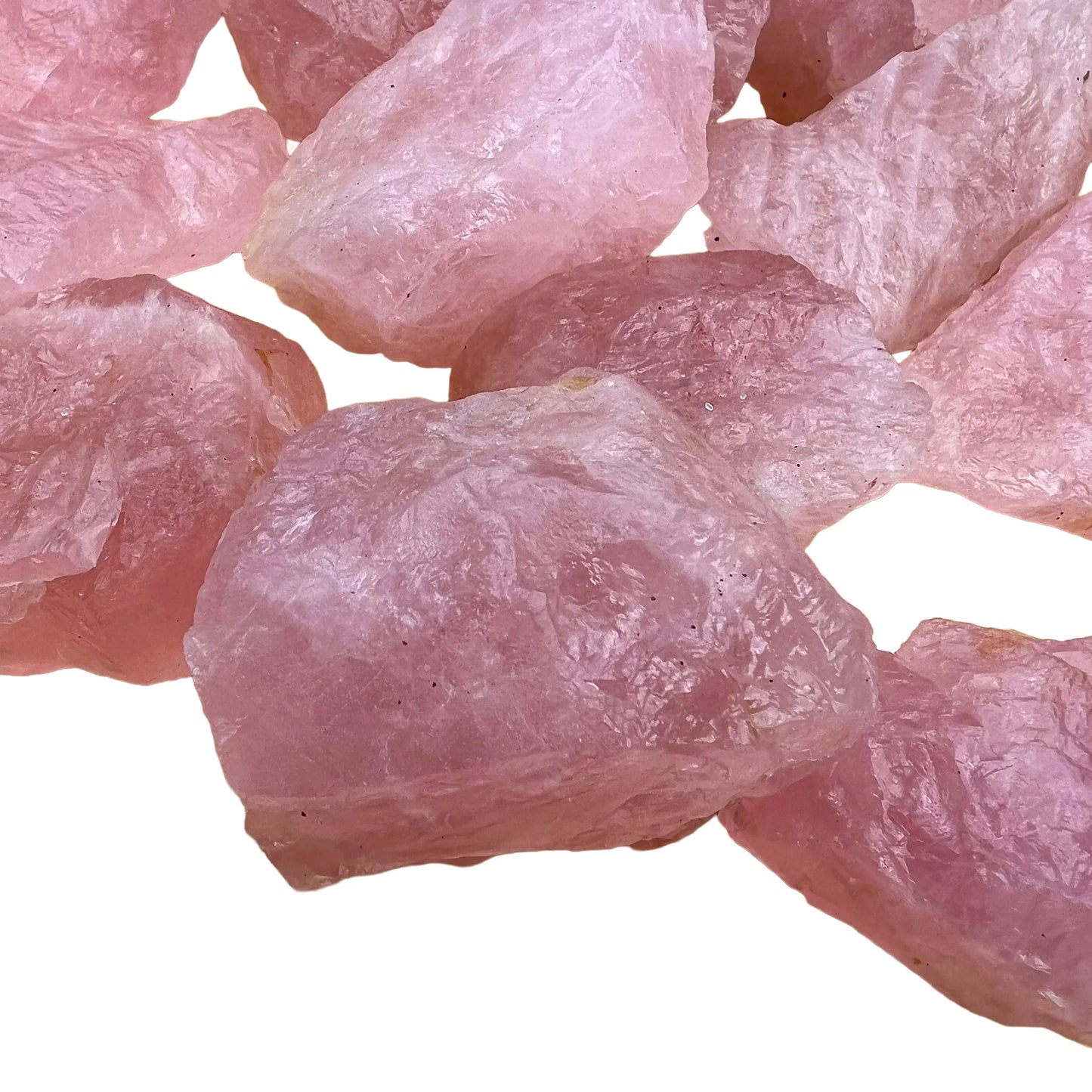 Considered view of Rose Quartz raw crystal, from Minas Gerais, Brazil, linked to Emotional Healing, with weight visible in the palm.
