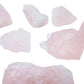 In-hand view of a single Rose Quartz raw stone sourced from Brazil.