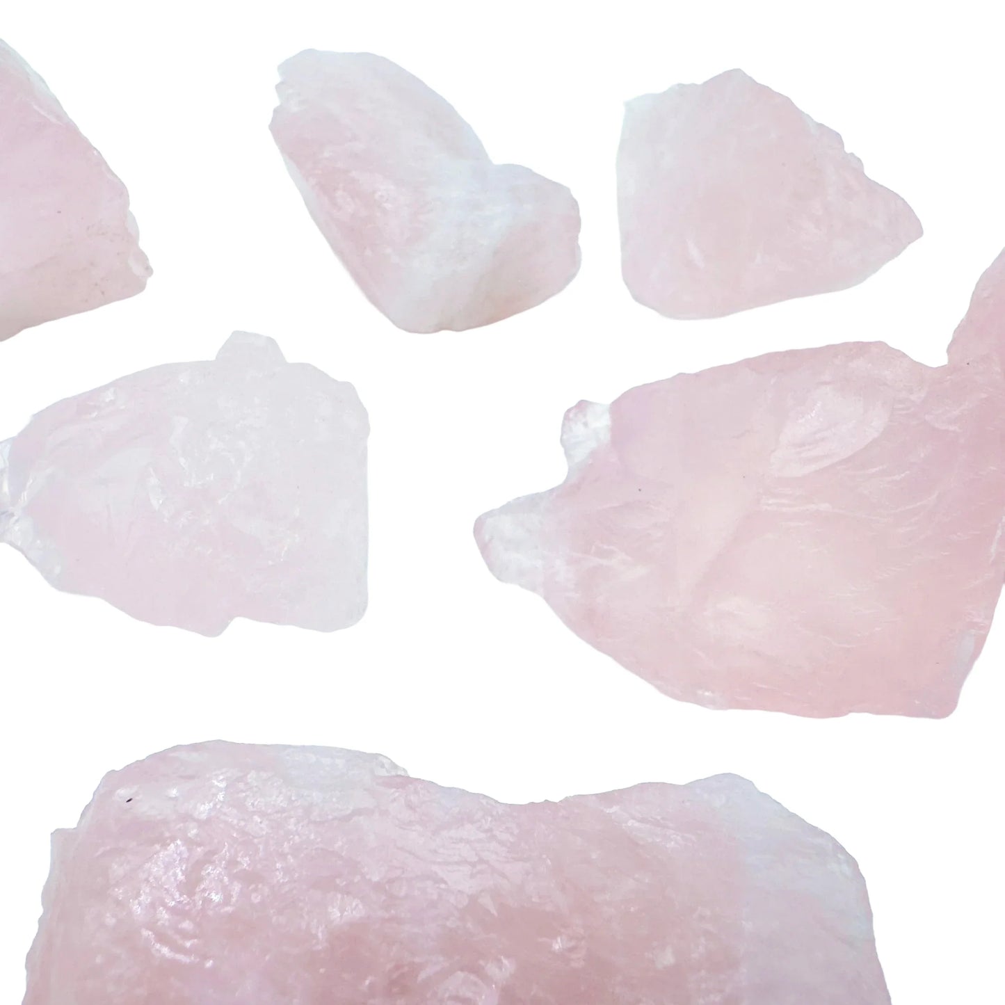 In-hand view of a single Rose Quartz raw stone sourced from Brazil.