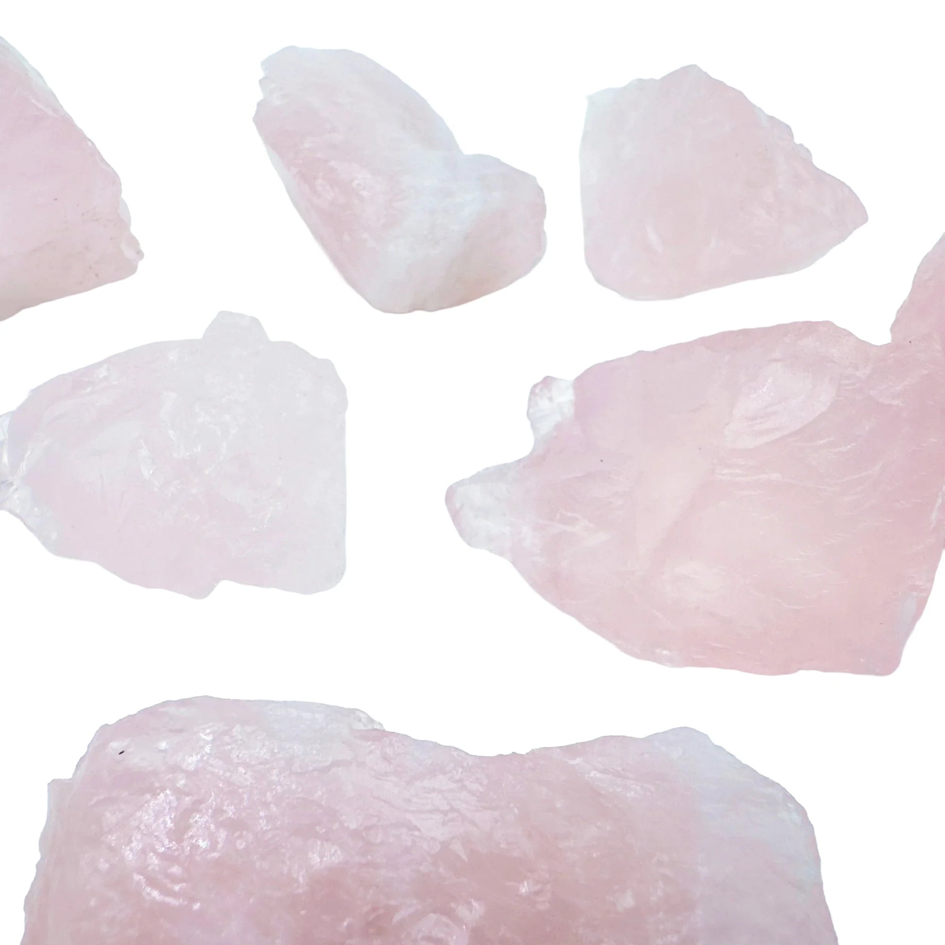 In-hand view of a single Rose Quartz raw stone sourced from Brazil.