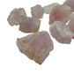 Plan view of Rose Quartz raw stone, showing natural banding.