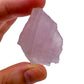 Hand-held view of a Rose Quartz raw stone, Madagascar-sourced, from Madagascar.