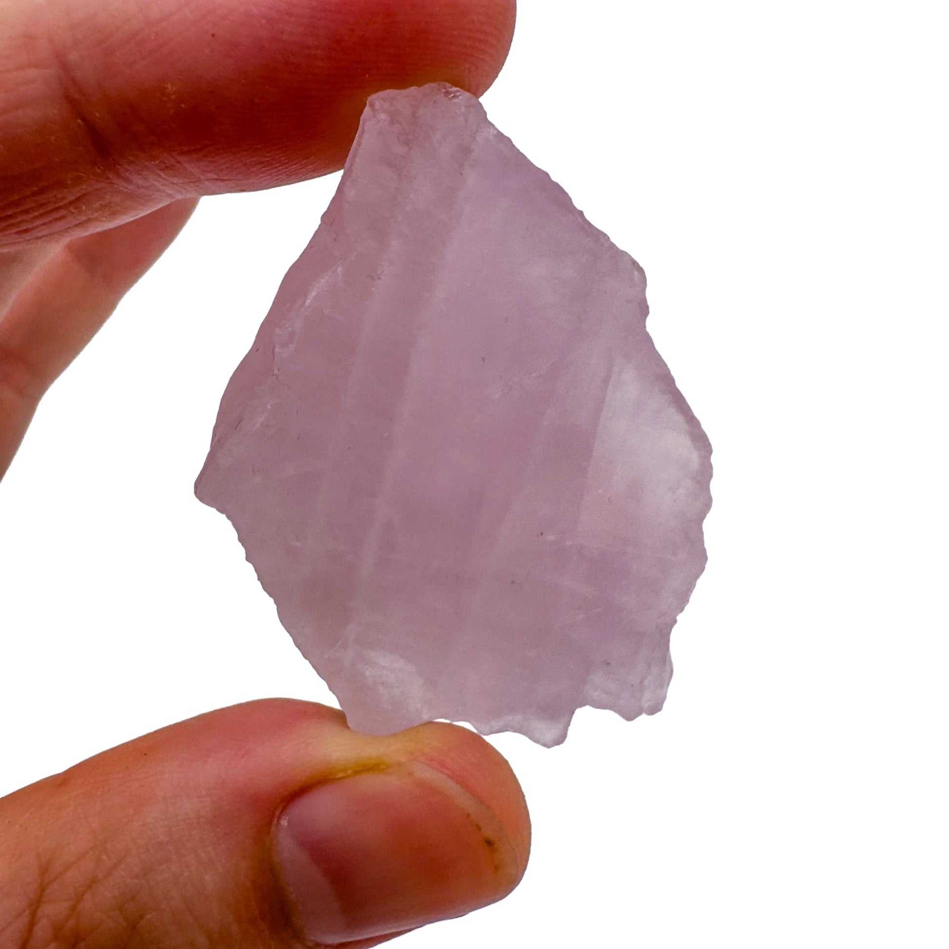 Hand-held view of a Rose Quartz raw stone, Madagascar-sourced, from Madagascar.