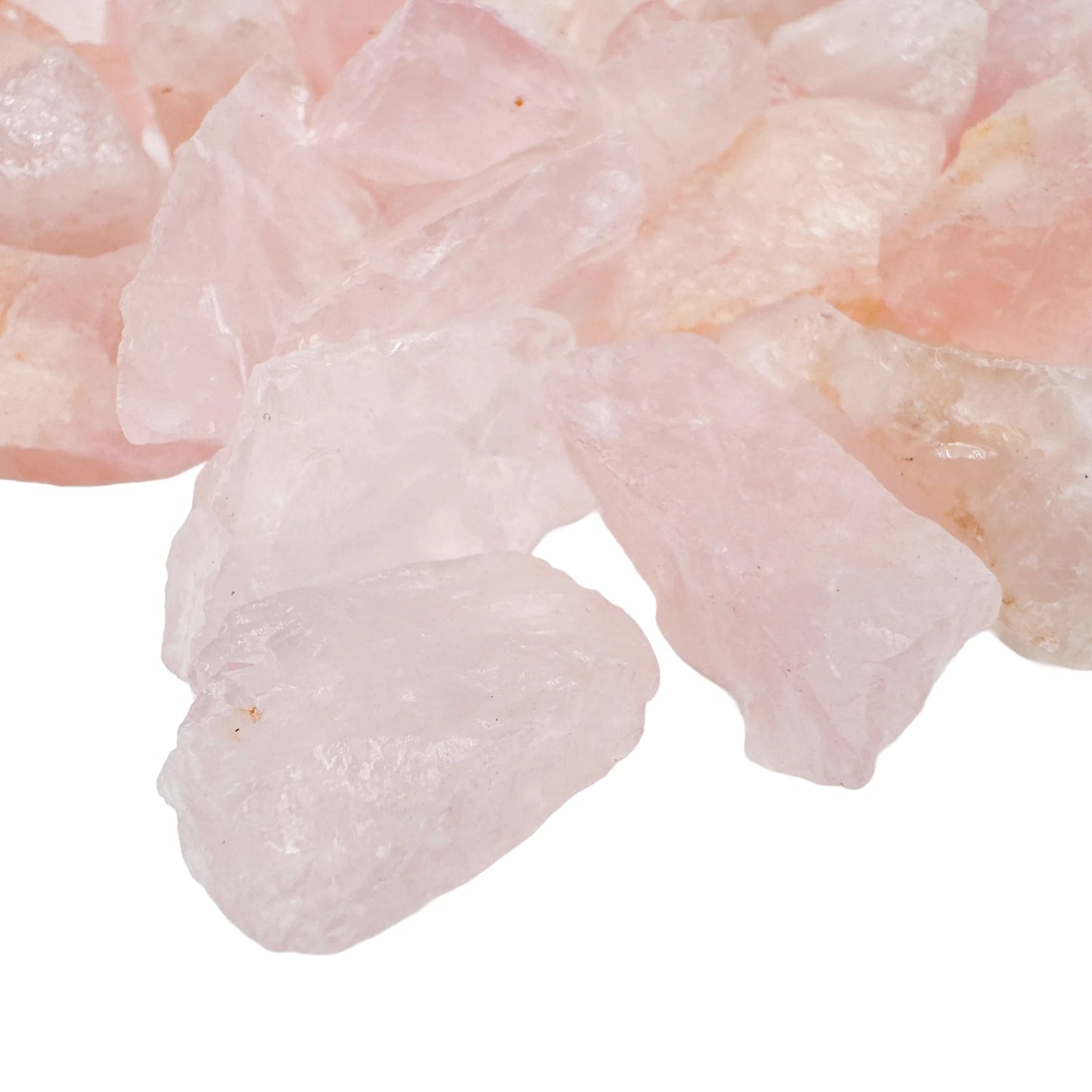 Side profile of Rose Quartz raw stone, sourced from Minas Gerais, Brazil, showing natural color depth.