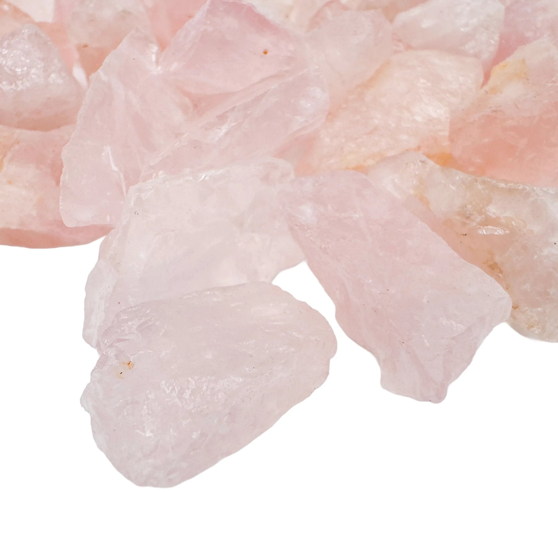 Side profile of Rose Quartz raw stone, sourced from Minas Gerais, Brazil, showing natural color depth.