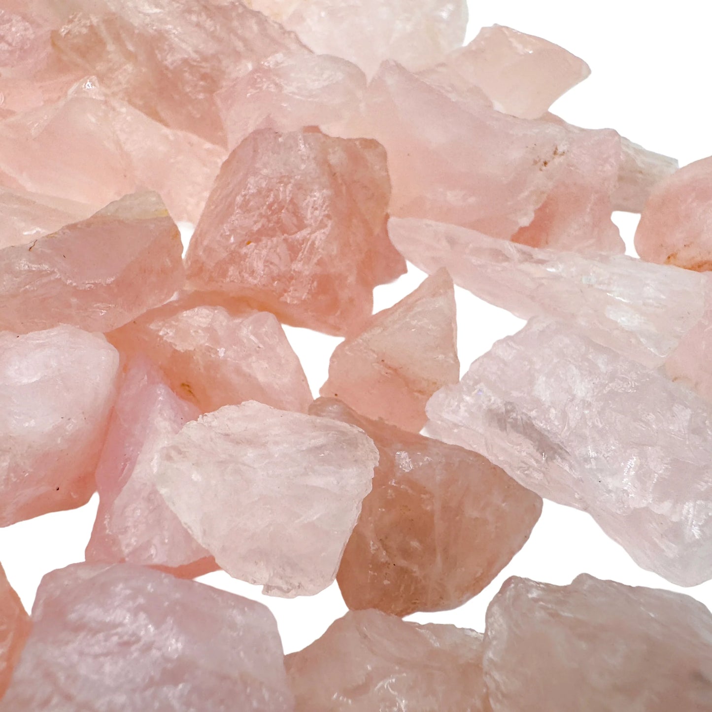 Hand holding small rose quartz raw stones 5-10 grams Brazil scale reference