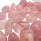 Back view of Rose Quartz tumbled stone, Brazil-sourced, showing natural texture.