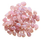 Detail shot of Grade AA Rose Quartz tumbled stone under natural light