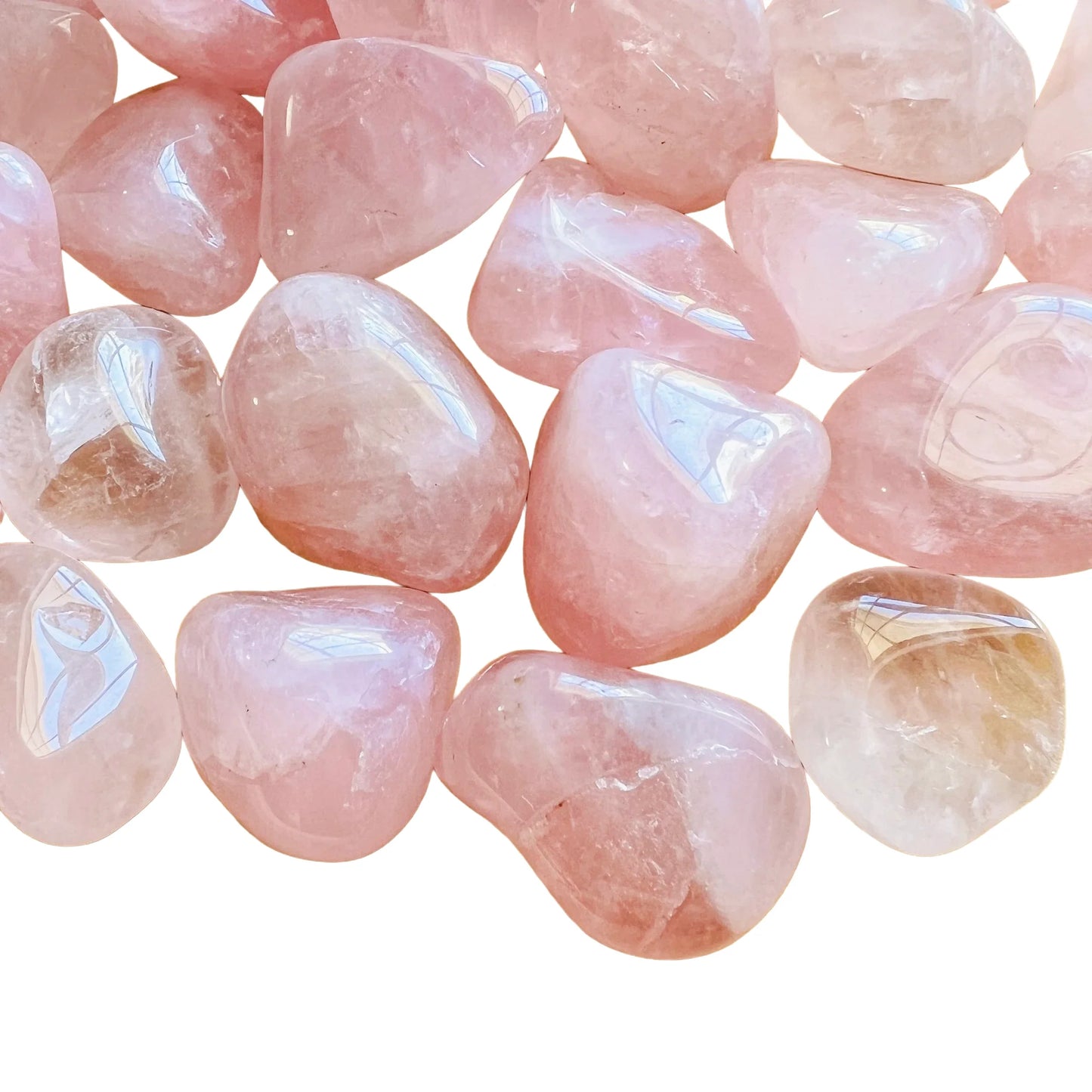 Detail capture of Rose Quartz tumbled stone, showing soft luster, sourced from Brazil.