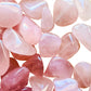 Overhead angle of Rose Quartz tumbled stone, showing characteristic color, often paired with practices around Love.