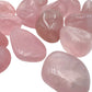 Underside view of Rose Quartz tumbled stone, showing translucent edges.