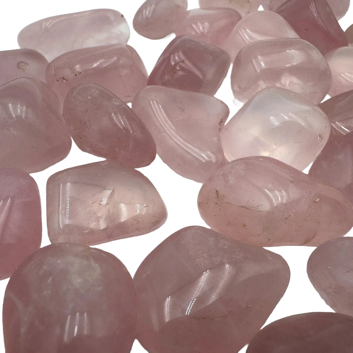 Scale reference of a single Rose Quartz tumbled stone Brazil-sourced, sourced from Brazil.