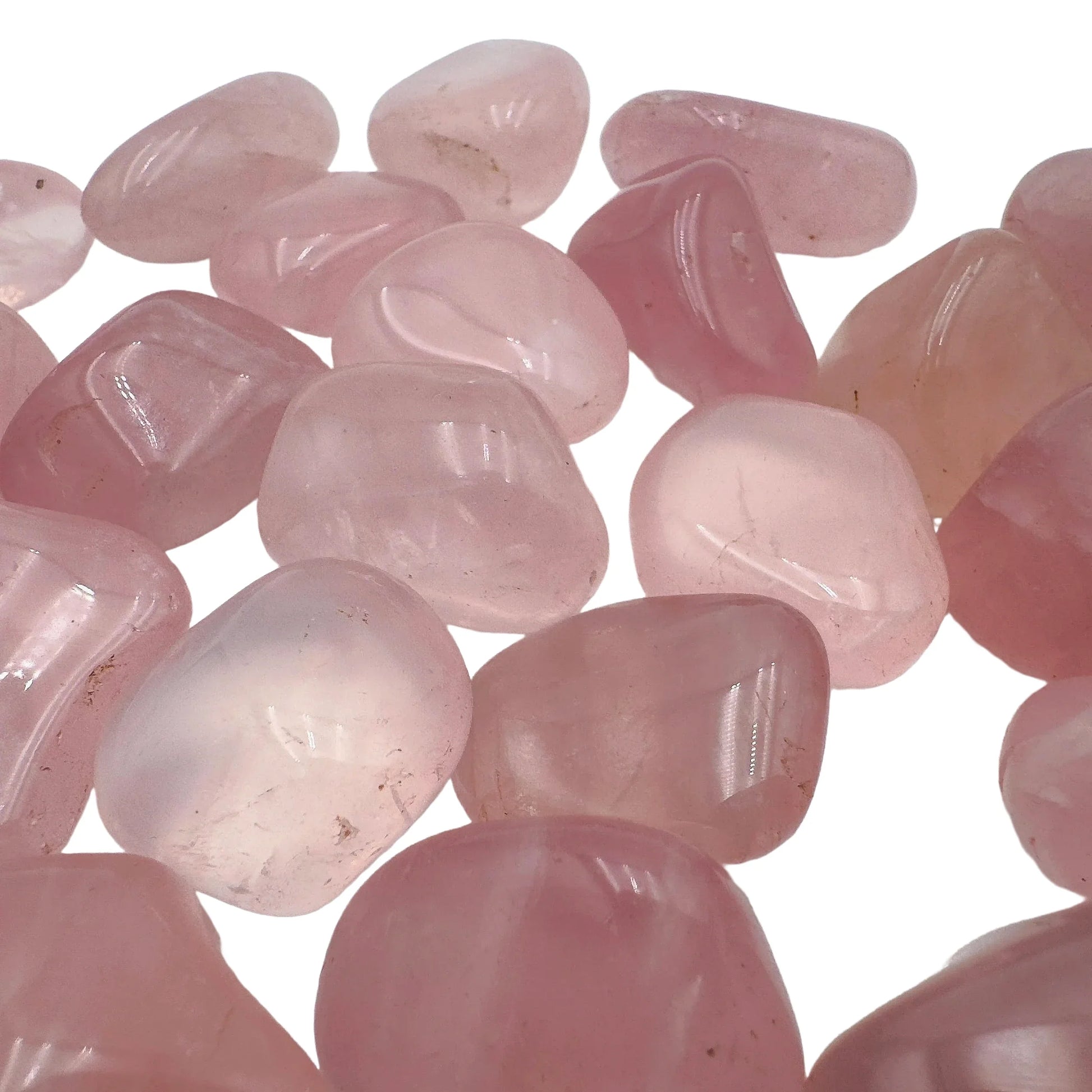 Grade aaa rose quartz tumbled stone held in hand for size reference