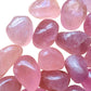 Side perspective of Rose Quartz tumbled stone, linked to Love, hand-selected from Minas Gerais, Brazil.