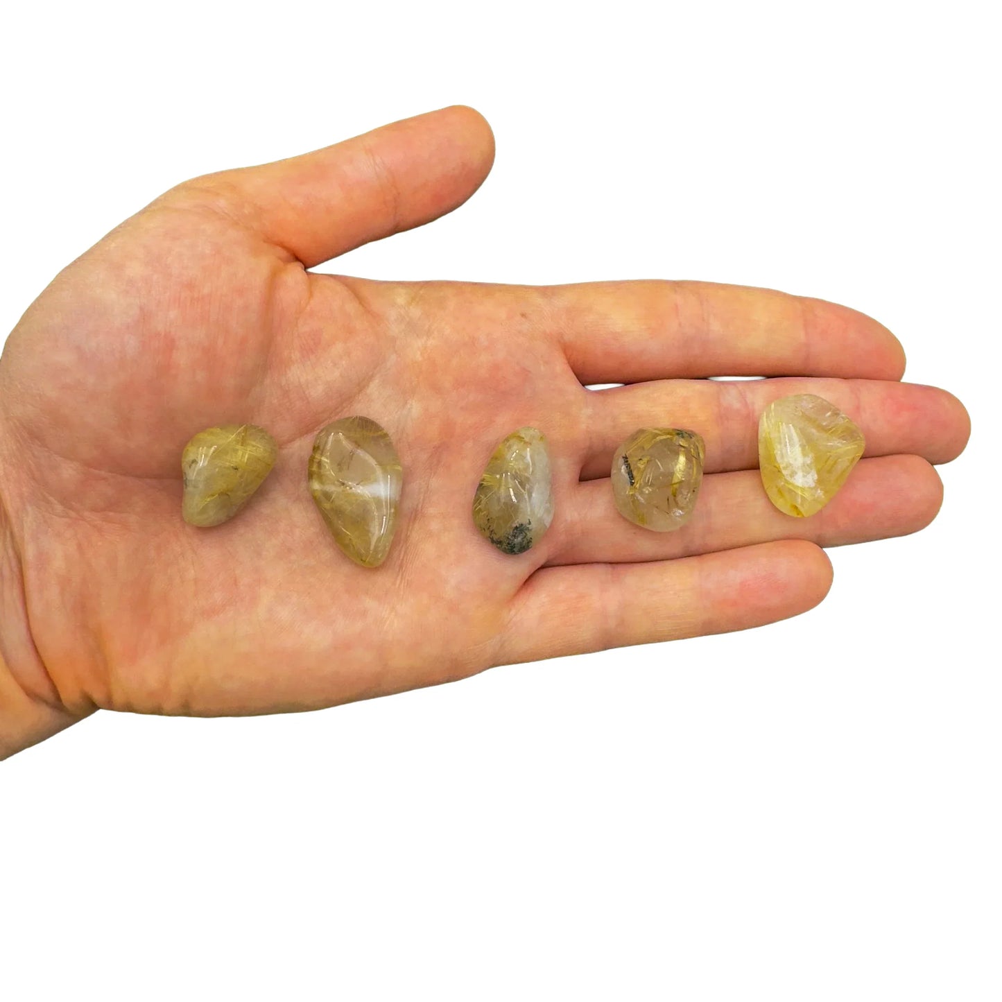 Lifestyle view of a single Quartz tumbled stone sourced from Brazil.