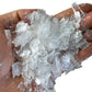 Overhead angle of Selenite polished chip, United States-sourced, kept near for Cleansing and Meditation.
