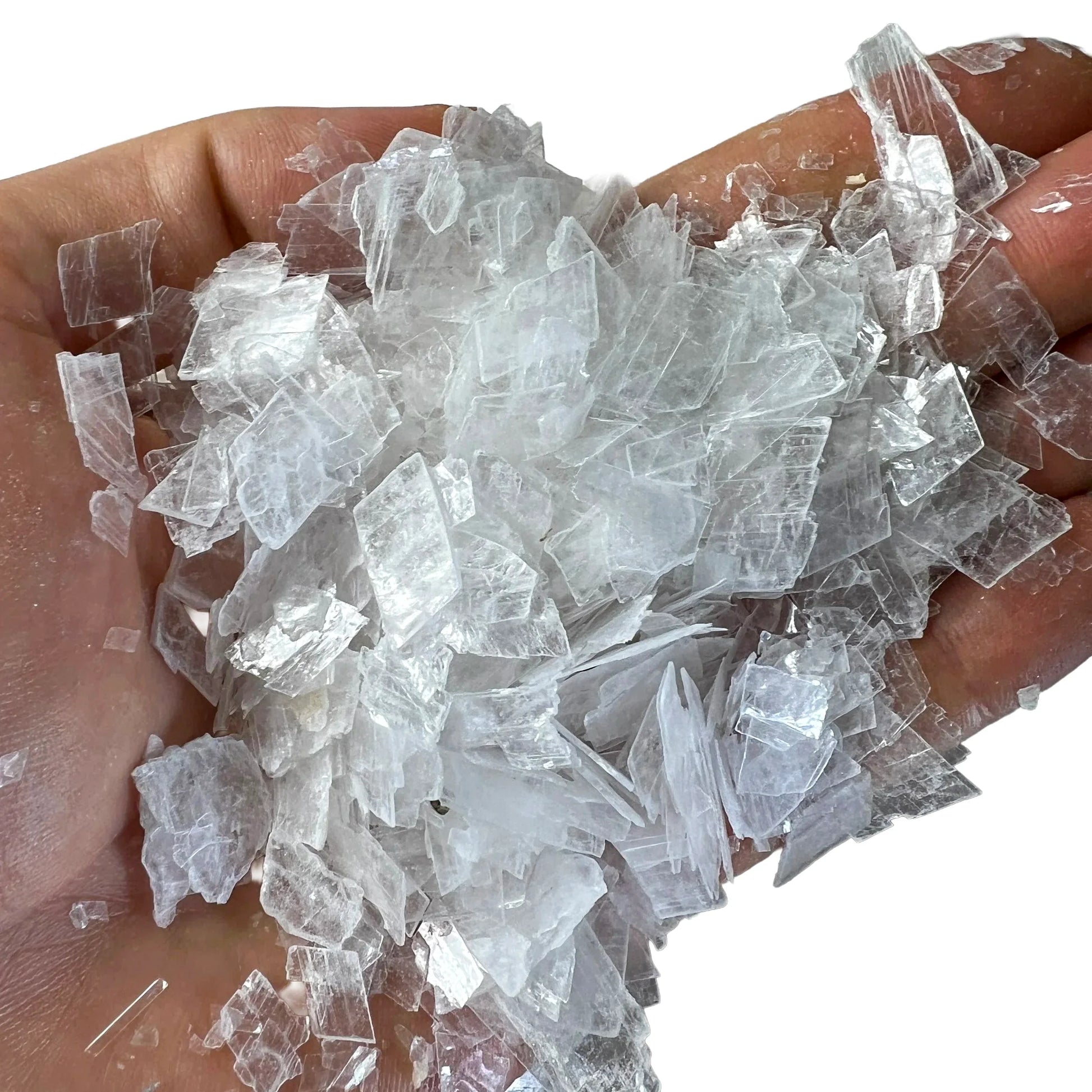 Overhead angle of Selenite polished chip, United States-sourced, kept near for Cleansing and Meditation.