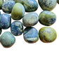 Side-on view of Grade AA Serpentine tumbled stone, sourced from Junín, Peru.