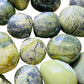 Alternate side of Serpentine tumbled stone, Peru-sourced, showing subtle veining.