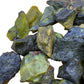 Side-on view of green Serpentine raw stone, showing raw matrix, sourced from Junín, Peru.