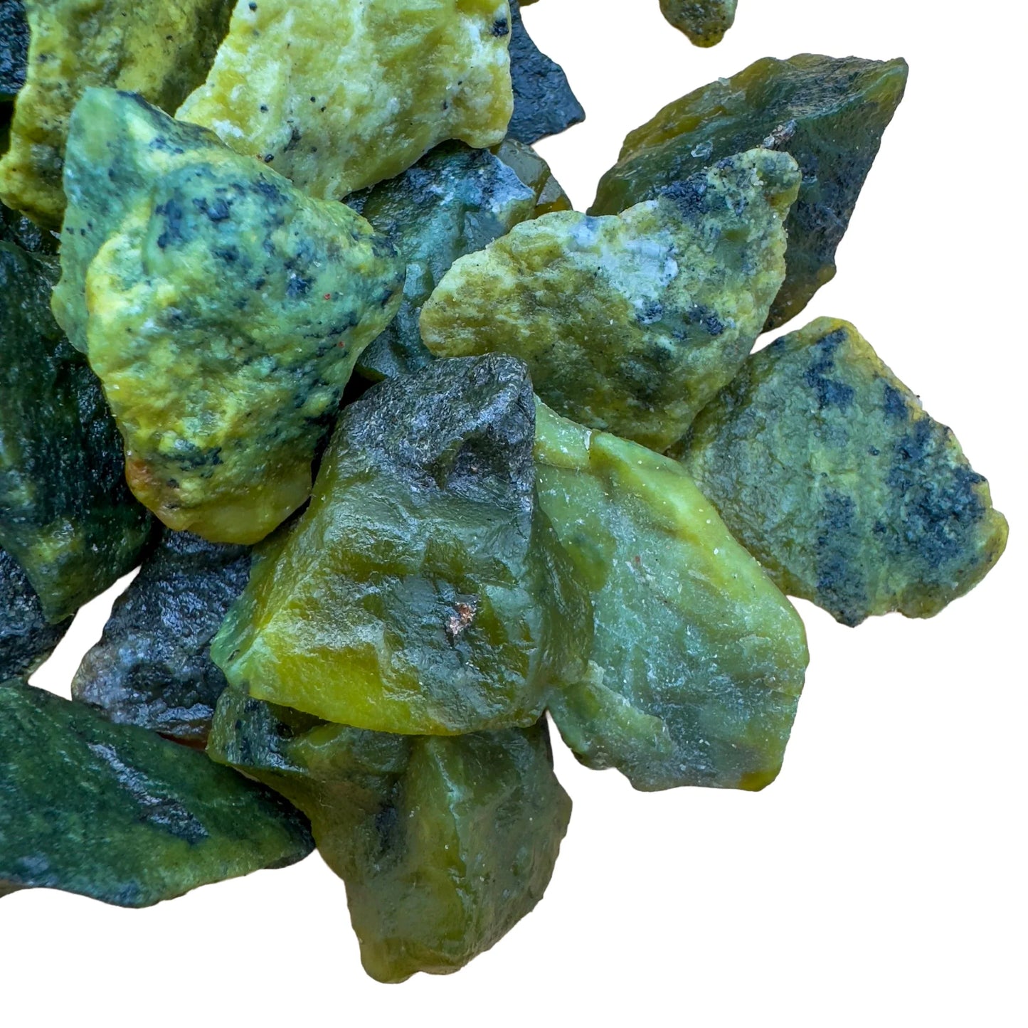 Bird's-eye view of green Serpentine raw stone, worked with for Healing, sourced from Peru.