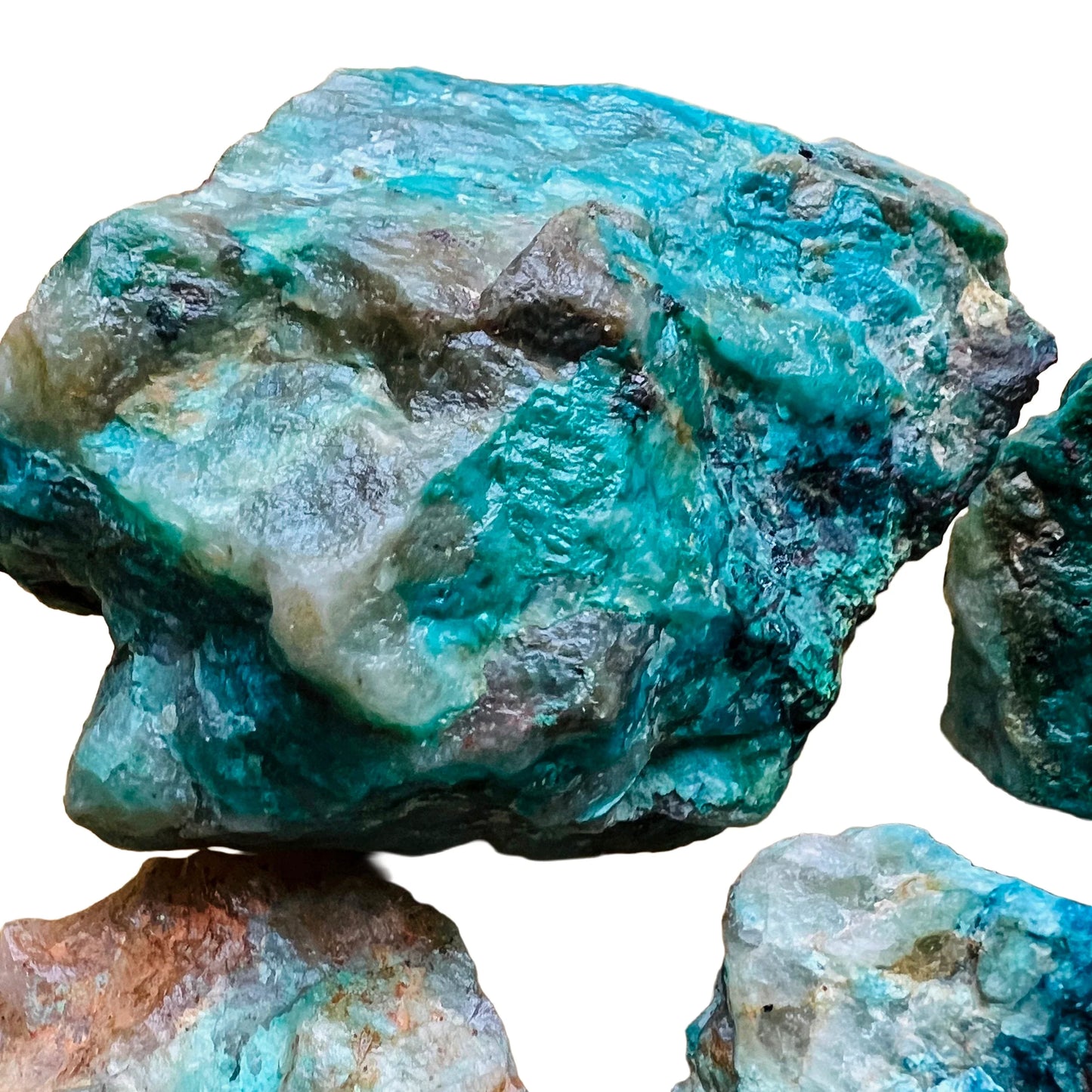 Sideways view of Chrysocolla raw stone, showing untreated character.