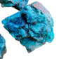 Scale reference of one Chrysocolla raw stone for scale, Namibia-sourced.