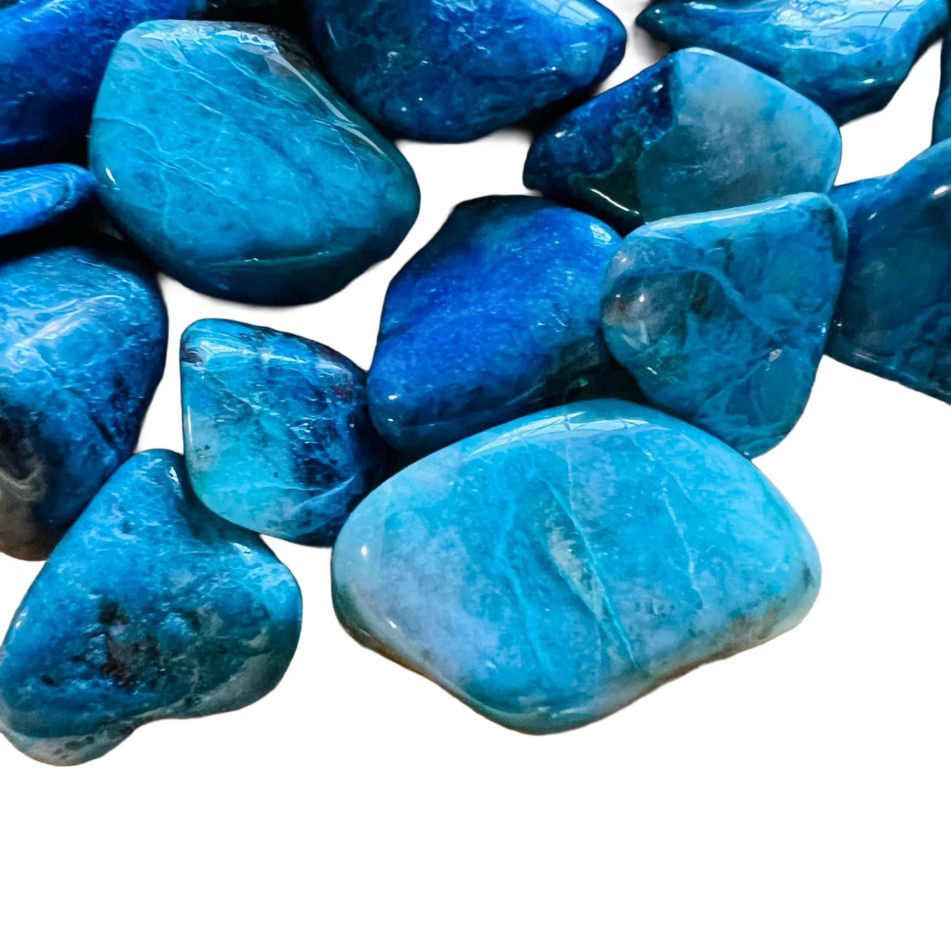 Sideways view of Chrysocolla tumbled stone, showing earthy tone.