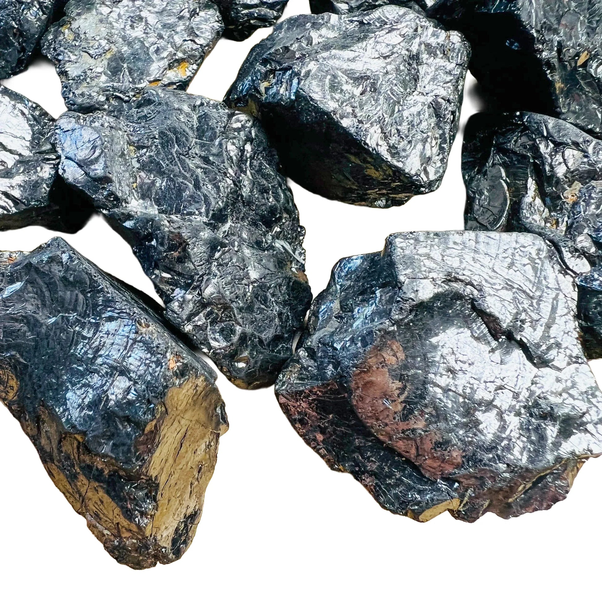 Edge-on view of Shungite raw stone, showing natural inclusions.
