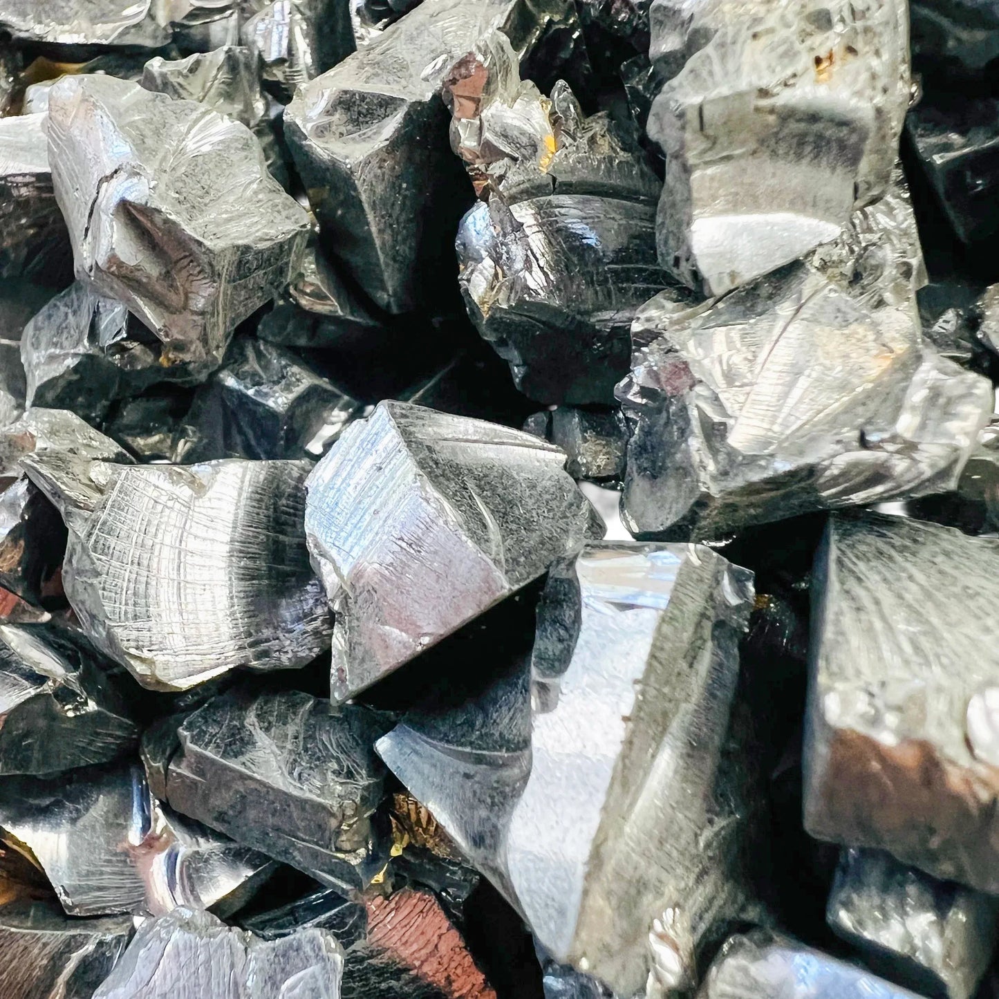 Top-down shot of Shungite raw stone, sourced from Republic of Karélia, Russia.