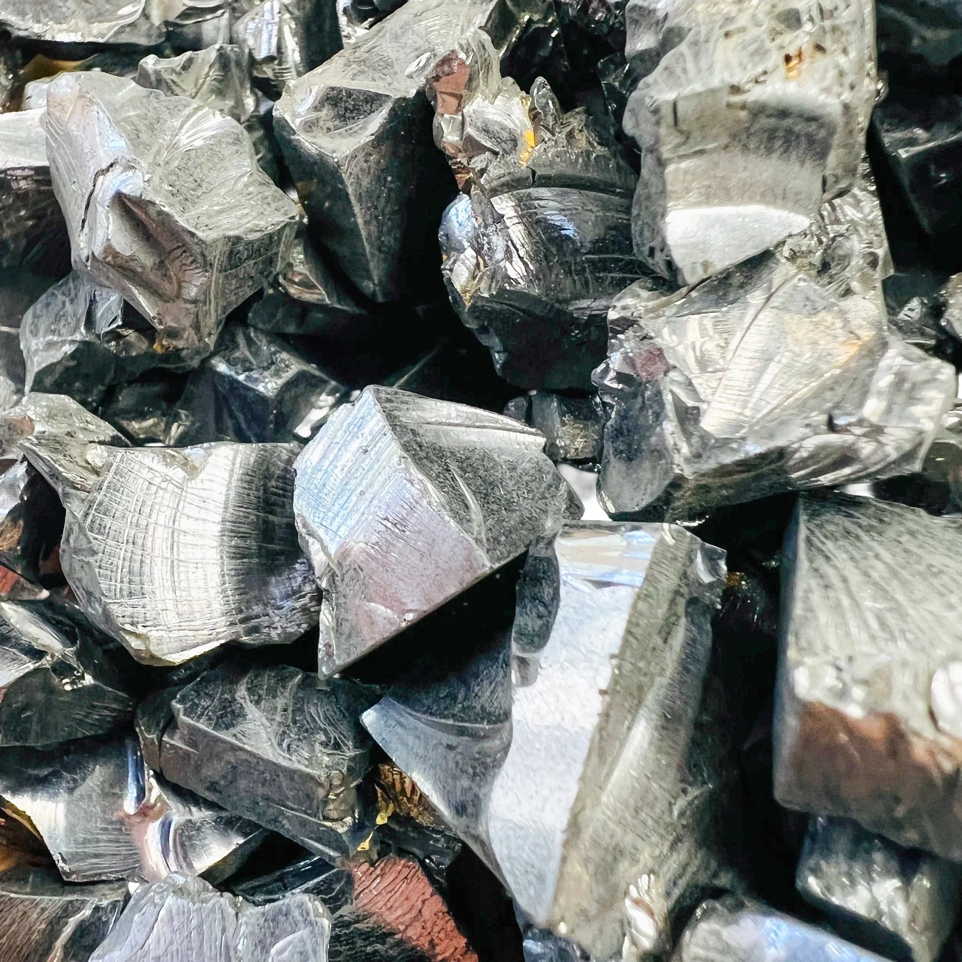 Top-down shot of Shungite raw stone, sourced from Republic of Karélia, Russia.