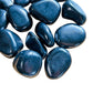Near view of Shungite tumbled stone, showing natural variation, drawn on for Protection.