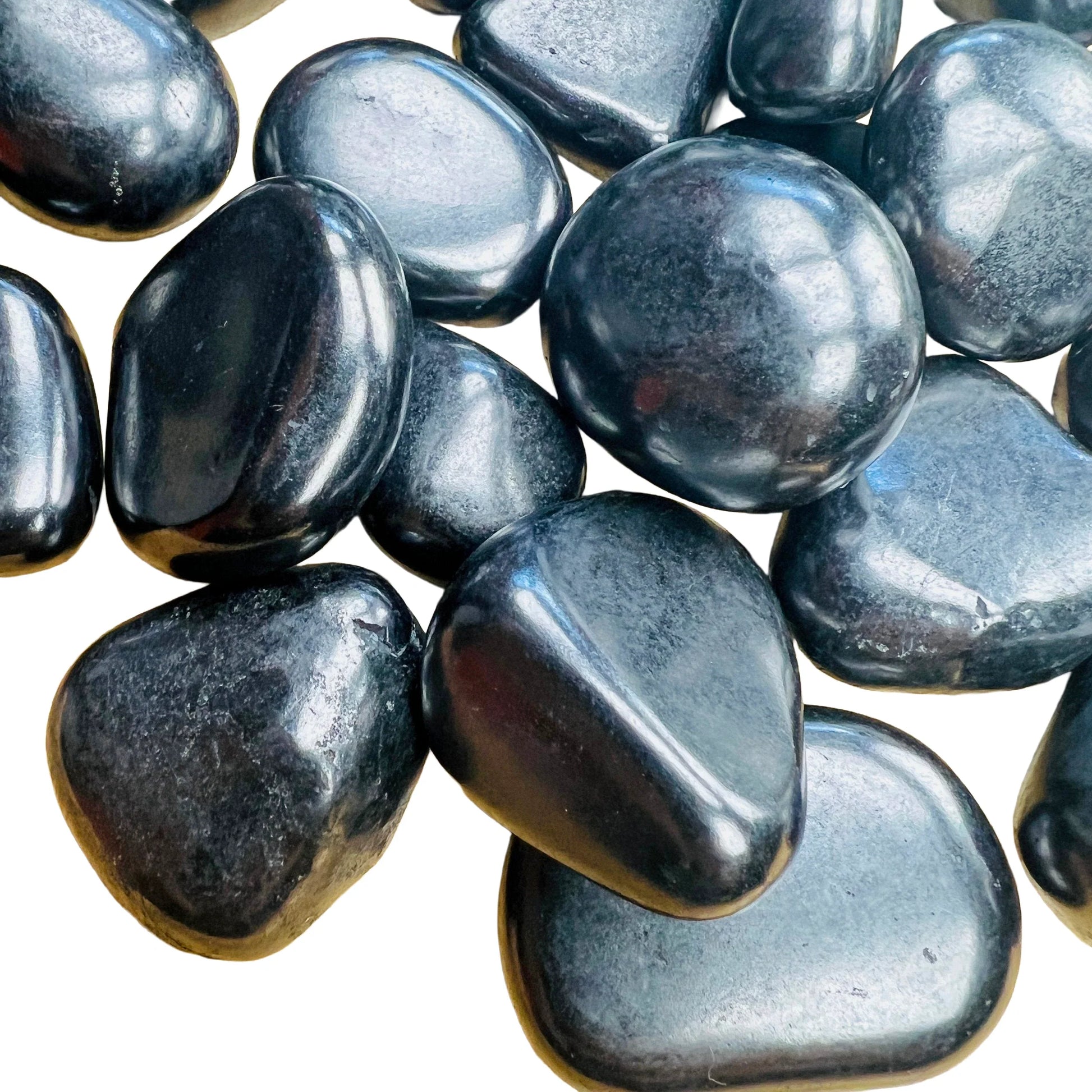 Natural surface of Shungite tumbled stone, showing natural texture.