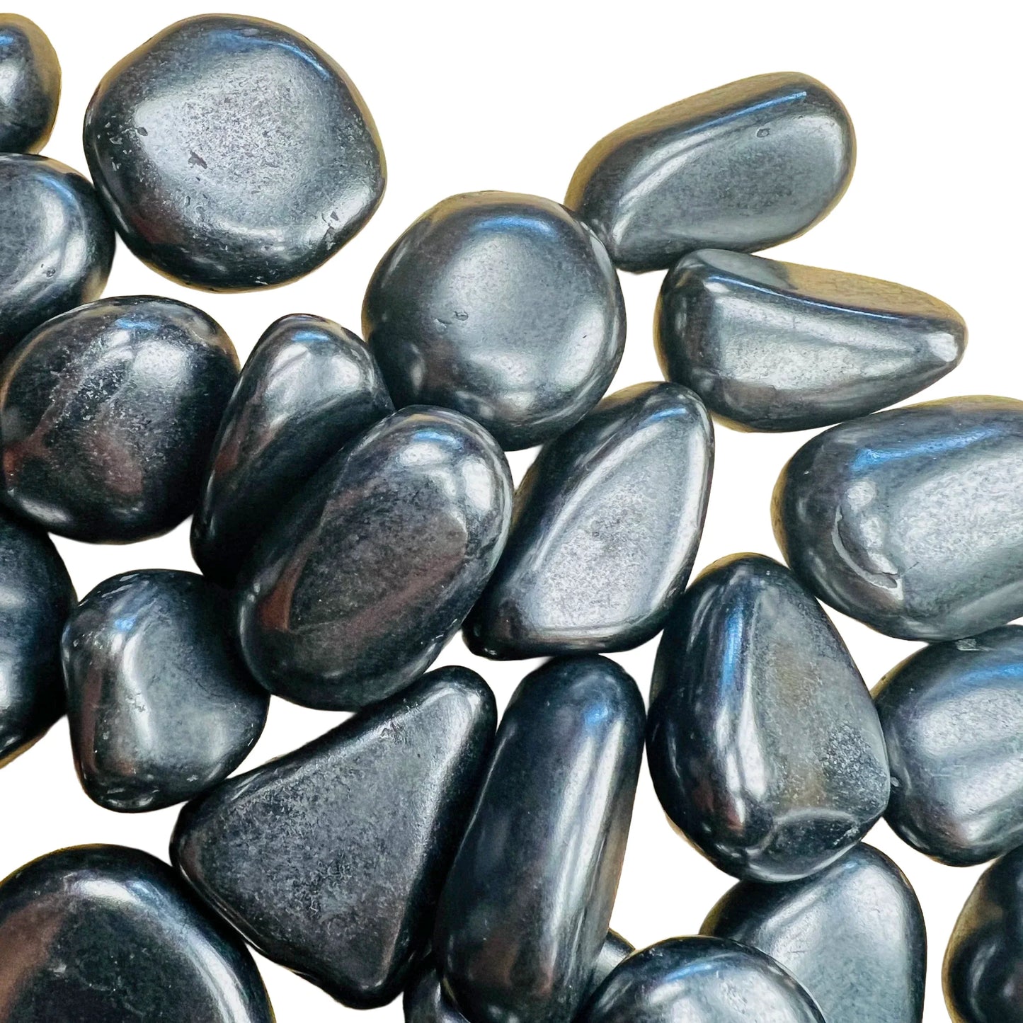 Reverse angle of Shungite tumbled stone, Russia-sourced, often paired with practices around Protection.