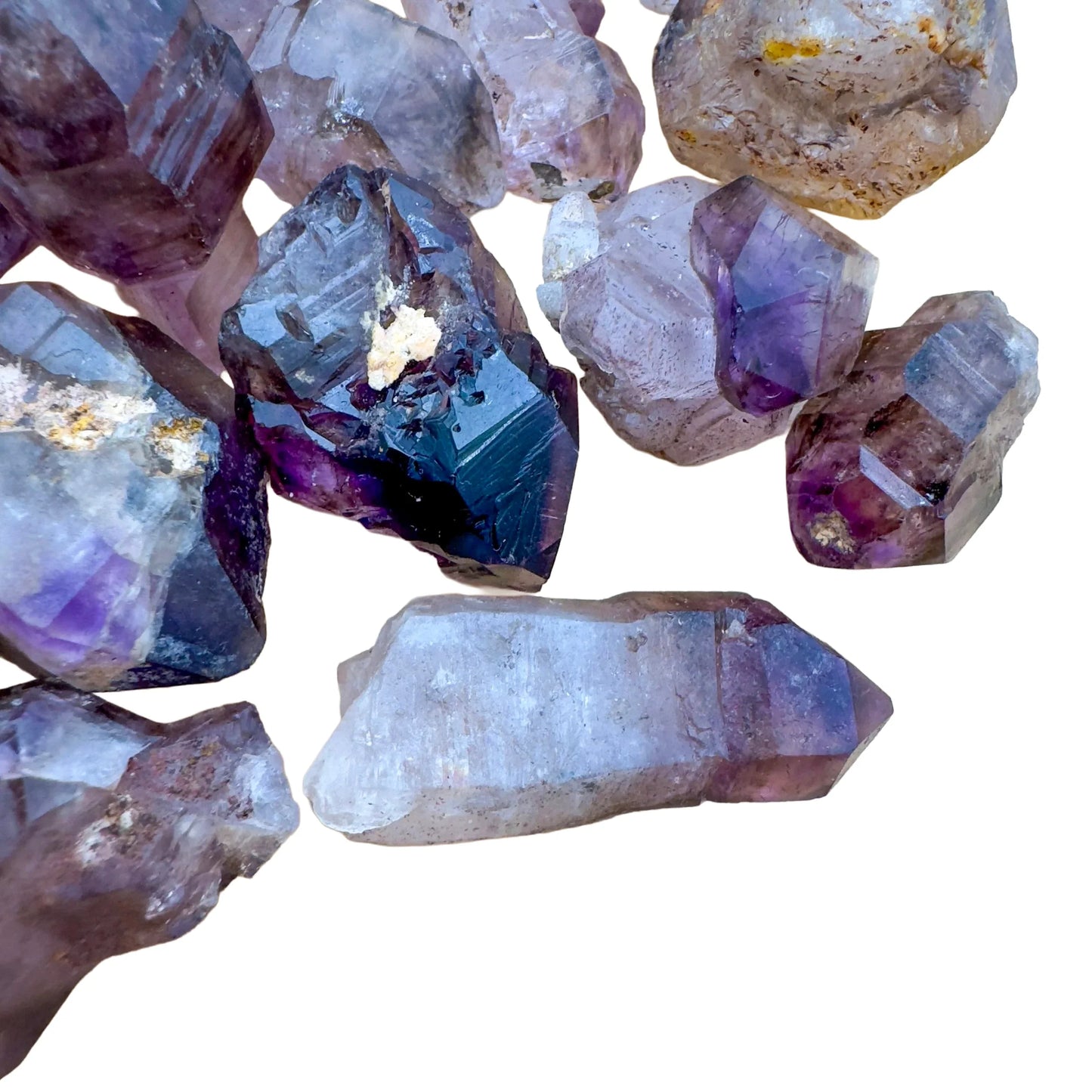 Tight crop of Smoky Amethyst raw point, sourced from Masvingo, Zimbabwe, showing subtle veining.