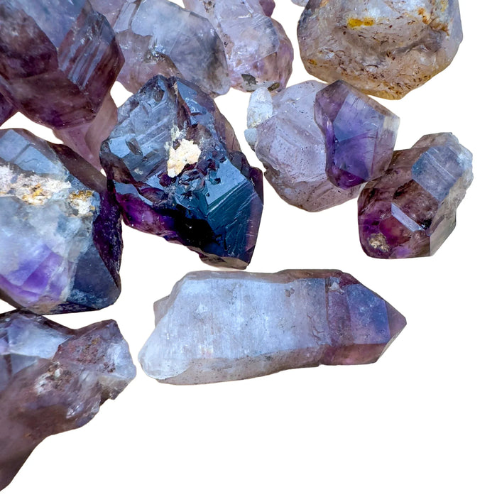Tight crop of Smoky Amethyst raw point, sourced from Masvingo, Zimbabwe, showing subtle veining.