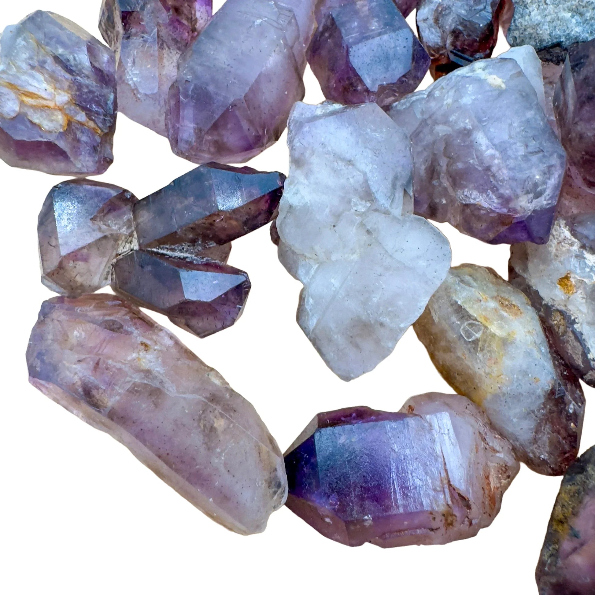 Side profile of Smoky Amethyst raw point, from Zimbabwe, showing subtle veining.